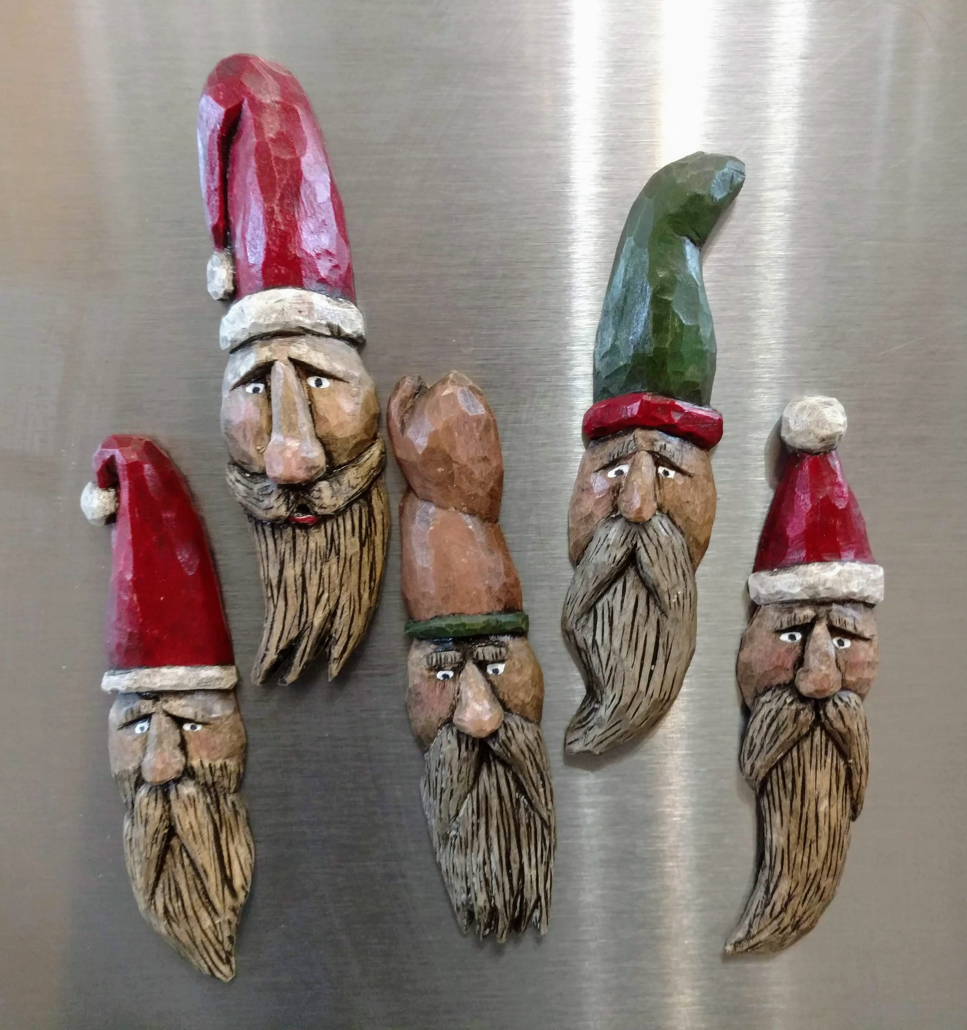 hand carved santa and wizard magnets